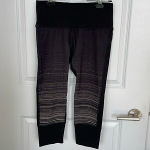 RYU Black athletic capri leggings with white stripes on front. Size M.